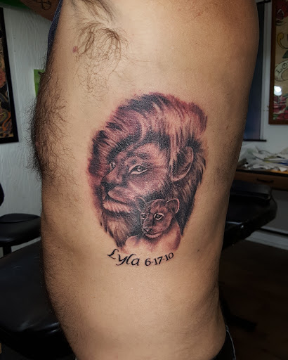 Explore leg tattoo ideas men, creative tattoo ideas in Eaton, available at Alley Cat Tattoos & Body