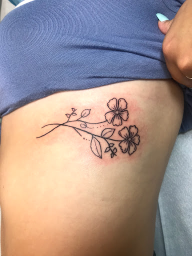 Explore female hand tattoo ideas, creative tattoo ideas in Aurora, available at Ronin Tattoo Studio INC