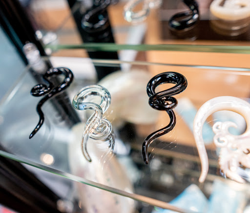 Explore wrist tattoo ideas men, creative tattoo ideas in Charleston, available at Exotic Impressions Body Piercing