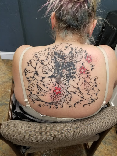 Explore jester tattoo ideas, creative tattoo ideas in Concord, available at Silver Needle Studios