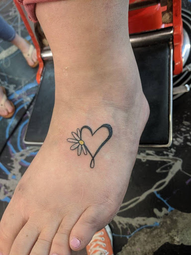 Explore polka trash tattoo ideas, creative tattoo ideas in Redding, available at Caddy Daddys