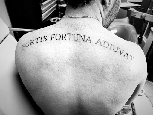 Explore mens rose tattoo ideas, creative tattoo ideas in Center Line, available at Elite Ink Tattoo Studios