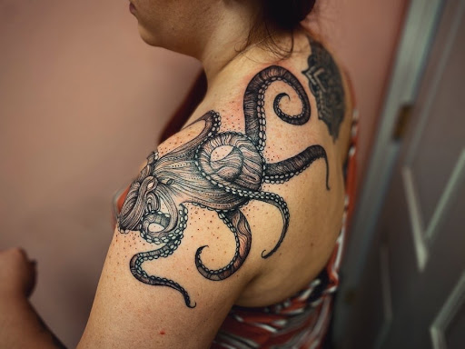 Explore gears of war tattoo ideas, creative tattoo ideas in Batavia, available at The Pretty Pin-Up Tattoo Parlor