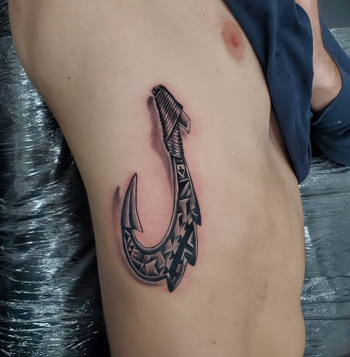 Explore religious elbow tattoo ideas, creative tattoo ideas in Miami, available at Tatt Em Up Tattoos & Piercings