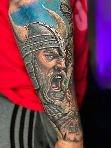 Explore muscle tattoo ideas, creative tattoo ideas in Fort Lauderdale, available at Bad Habits Tattoos & Laser Tattoo Removal