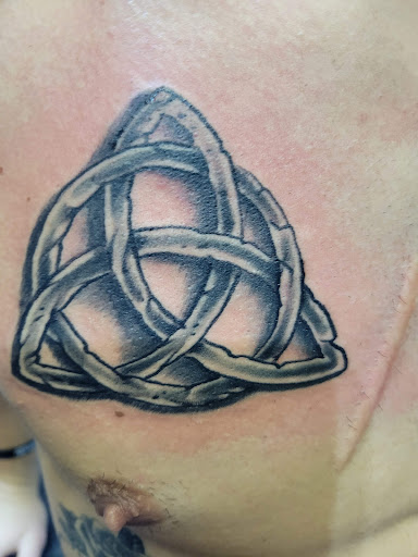 Explore lion forearm tattoo ideas, creative tattoo ideas in Angola, available at Hoodlum Ink