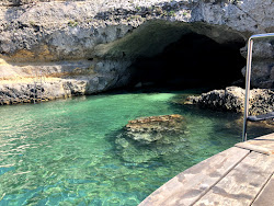 Fotografija Grotta delle Pupe z modra čista voda površino