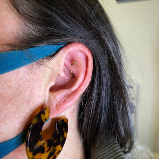 Explore time flies tattoo ideas, creative tattoo ideas in Louisburg, available at Purple Dot Piercings