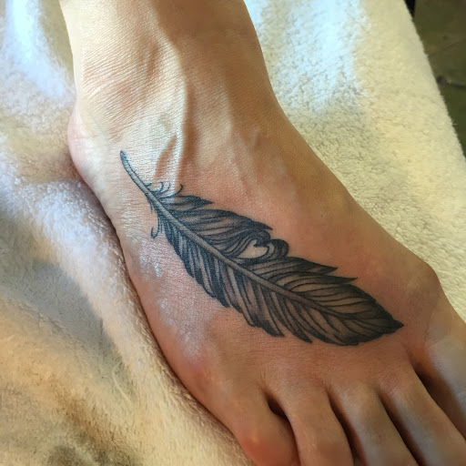 Explore spartan helmet tattoo ideas, creative tattoo ideas in Reno, available at Aces Tattoo