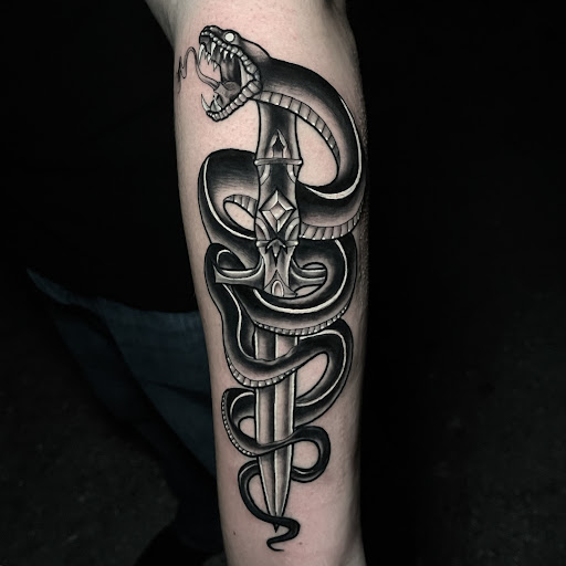 Explore tribal back tattoo ideas, creative tattoo ideas in Fort Myers, available at Loyal 2 The Coil Tattoos & Piercings (Edison Mall Location Entrance F)