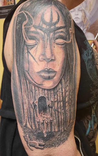 Find tattoo between breast ideas for your next unique tattoo in Independence at Odins Mark Tattoo and Emporium