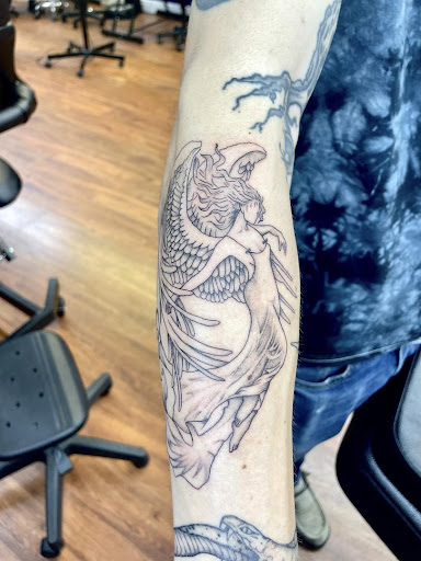 Explore lesbian couple tattoo ideas, creative tattoo ideas in Cocoa, available at Rorschach Tattoo Shop and Piercing Studio