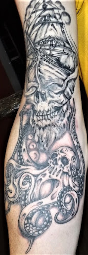 Explore tattoo leg ideas, creative tattoo ideas in Muscatine, available at Stigma Tattoo & Body Piercing