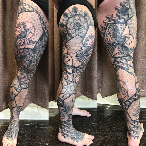 Explore half sleeve men tattoo ideas, creative tattoo ideas in Fredonia, available at Red Bird Tattoo