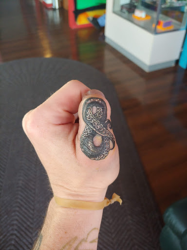 Explore spark plug tattoo ideas, creative tattoo ideas in Williamston, available at Inkd Tattoo Parlor