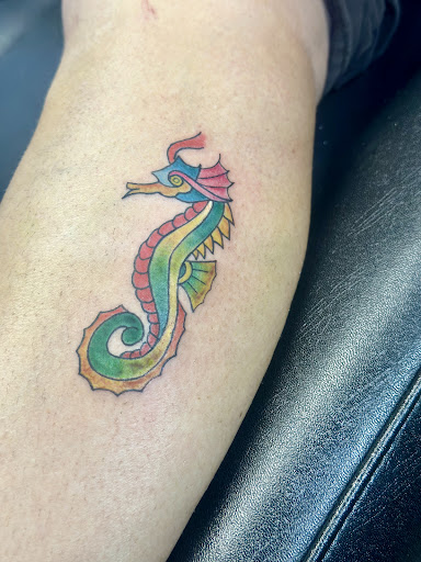 Explore grinch tattoo ideas, creative tattoo ideas in Whitehall, available at Beachside Tattoos & Smoke Shop