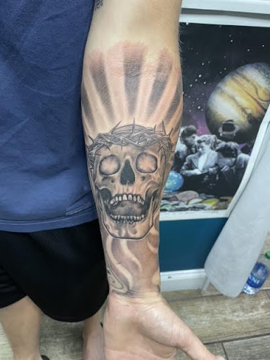 Explore patriotic forearm tattoo ideas, creative tattoo ideas in Buford, available at Wild Tribe Tattoos and Piercings
