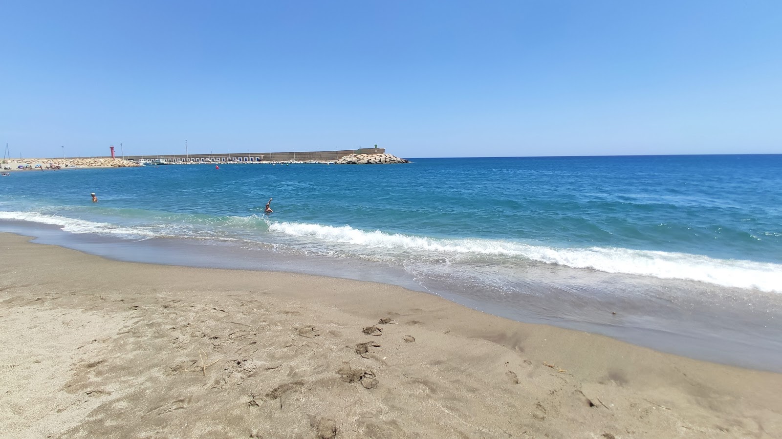 Foto di Playa de las Martinicas con baia lunga