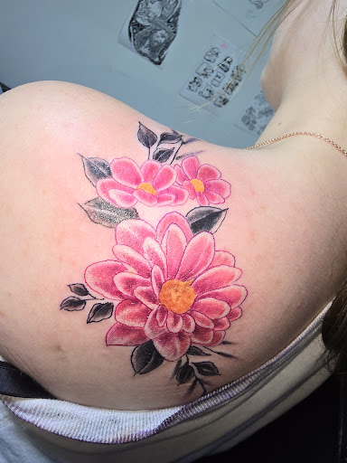 Explore tattoo ideas for arms and shoulders, creative tattoo ideas in Angola, available at Hoodlum Ink