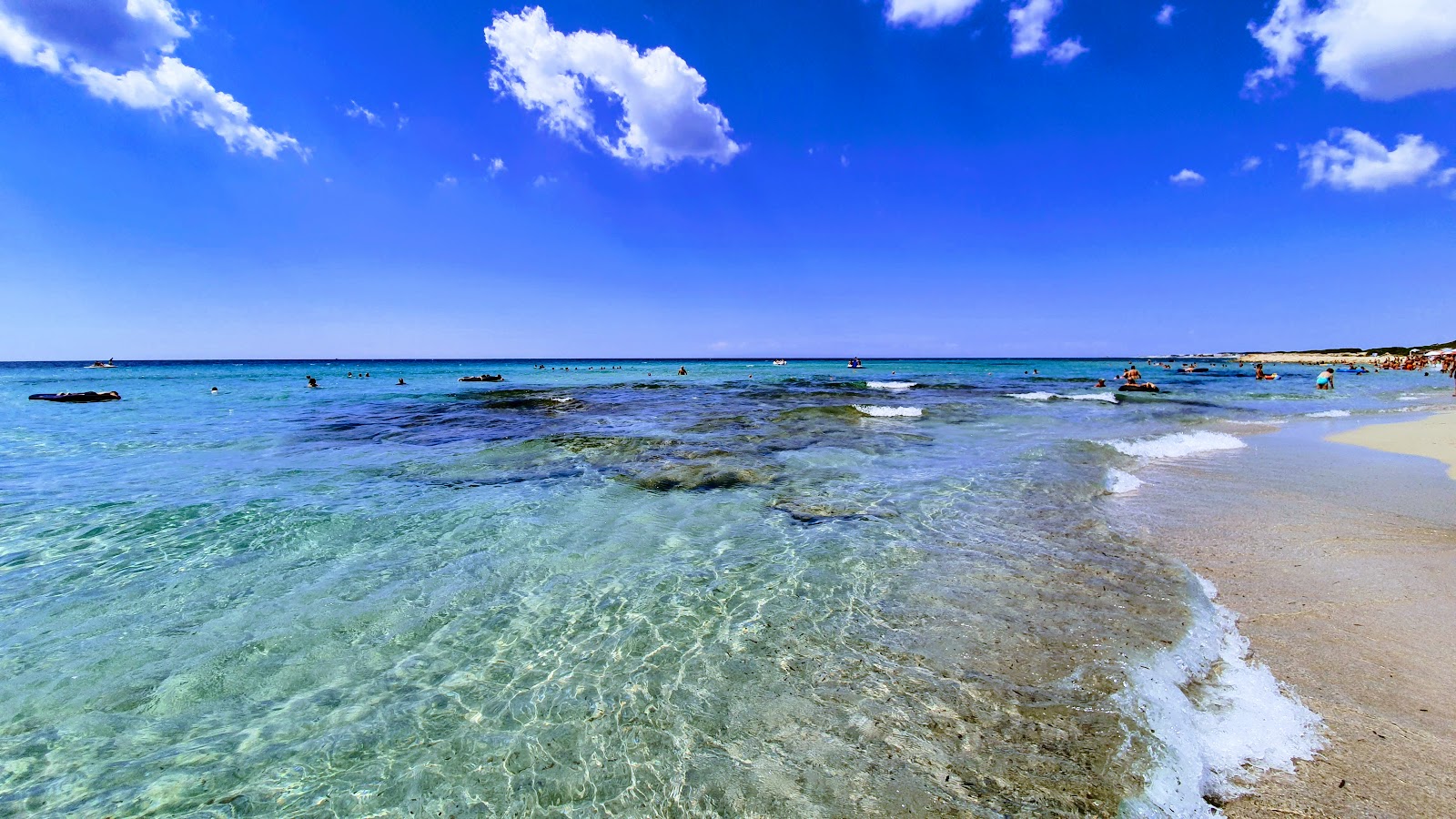 Foto de Conca del Sole com areia fina e brilhante superfície