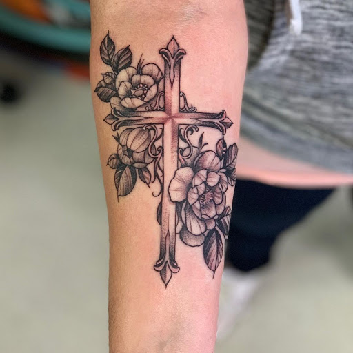 Explore cross tattoo ideas for females, creative tattoo ideas in San Diego, available at Wylde Sydes Tattoo & Body Piercing