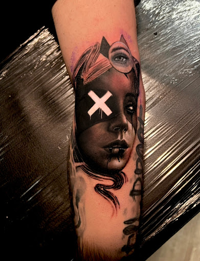 Explore book dragon tattoo ideas, creative tattoo ideas in Tiffin, available at Ink Element Tattoo Studio