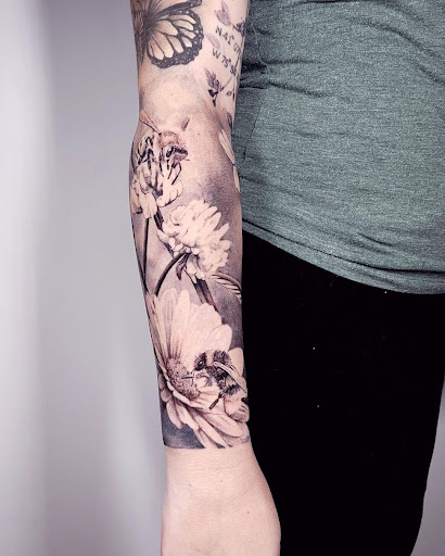 Explore parrot tattoo ideas, creative tattoo ideas in Kissimmee, available at Fallen Sparrow Tattoo Co