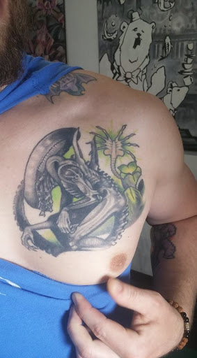 Explore race car tattoo ideas, creative tattoo ideas in Buffalo, available at Arboreal Ink - Tattoo and Piercing