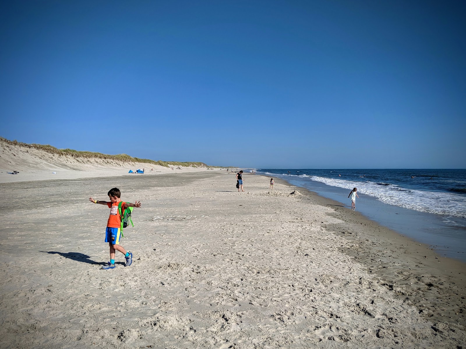 Fotografija Stranden Beach z svetel pesek površino