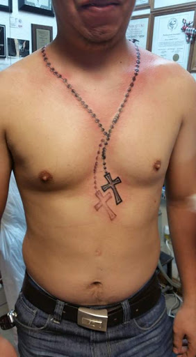 Explore catholic tattoo ideas for guys, creative tattoo ideas in Elko, available at Tom Custom Tattoos and Body Piercing Studio