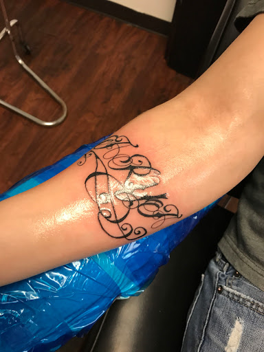 Explore grandkids names tattoo ideas, creative tattoo ideas in Seymour, available at American Gypsy Tattoo Corp.