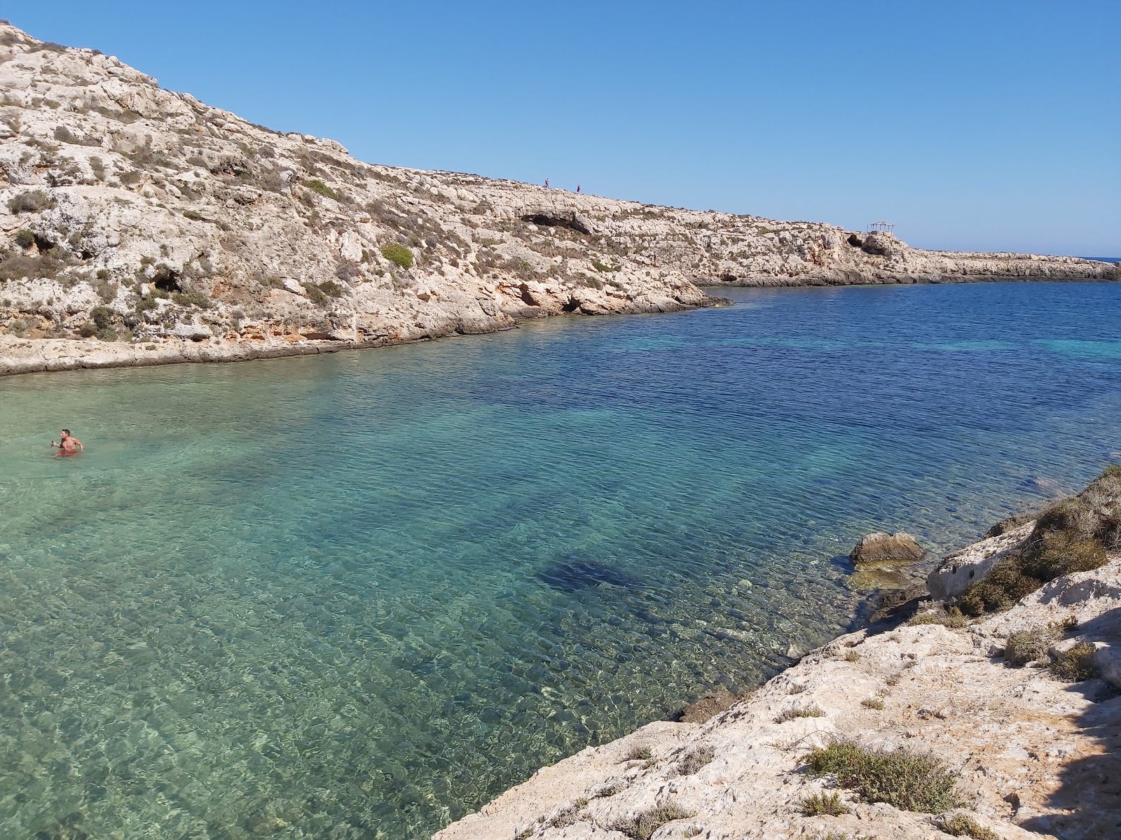 Photo of Cala Galera with turquoise pure water surface