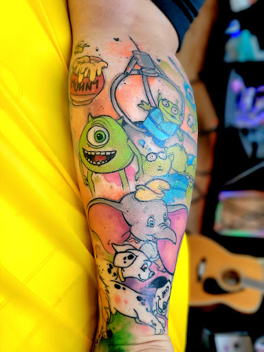 Explore half leg sleeve tattoo ideas for men, creative tattoo ideas in Benton, available at Spectrum Tattoo