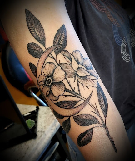 Explore atom tattoo ideas, creative tattoo ideas in Abington, available at Tattoo Galaxy (Abington) Piercing and Custom Tattoos