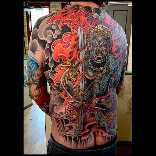 Explore tomahawk tattoo ideas, creative tattoo ideas in Milwaukee, available at Solid State Tattoo