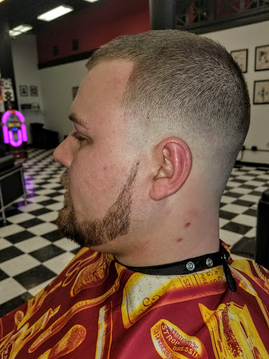 Explore dinosaur tattoo ideas for son, creative tattoo ideas in Buffalo, available at The Salty Dog Barbershop