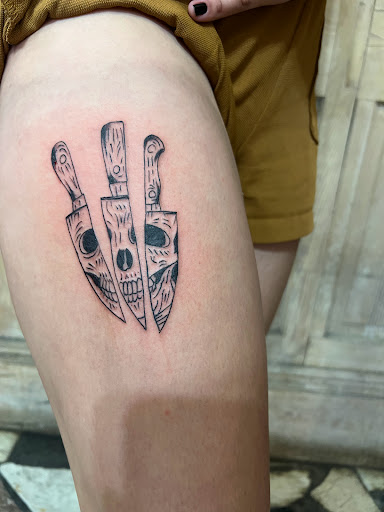 Explore cover up tattoo ideas on thigh, creative tattoo ideas in New Orleans, available at Downtown Tattoos and Piercing