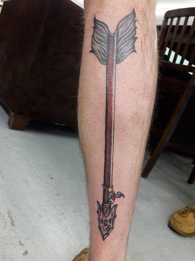 Explore feminine cross tattoo ideas, creative tattoo ideas in Panama City Beach, available at Revolution Tattoo & Body Piercing