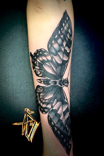 Explore tattoo initials ideas, creative tattoo ideas in Menomonee Falls, available at Color Bomb Tattoo Shop and Body Piercing