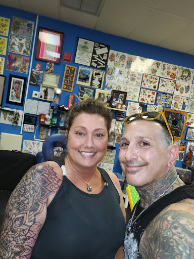 Explore tattoo ideas dogs, creative tattoo ideas in Englewood, available at The Original Big Daddy Tattoo & Body Piercing est.1997 est.1997