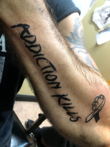 Explore charlie brown tattoo ideas, creative tattoo ideas in Okeechobee, available at Muck City Tattoos & Piercings