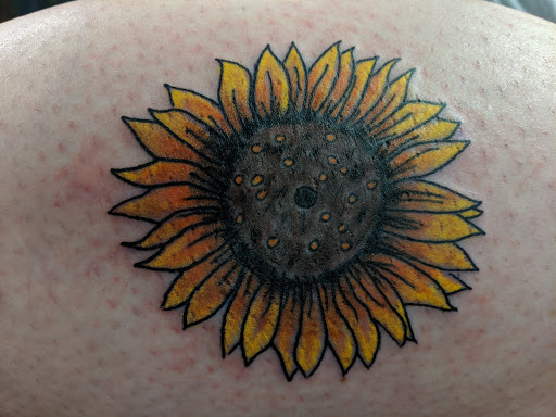 Explore forearm flower tattoo ideas, creative tattoo ideas in Abilene, available at Downtown Tattoo