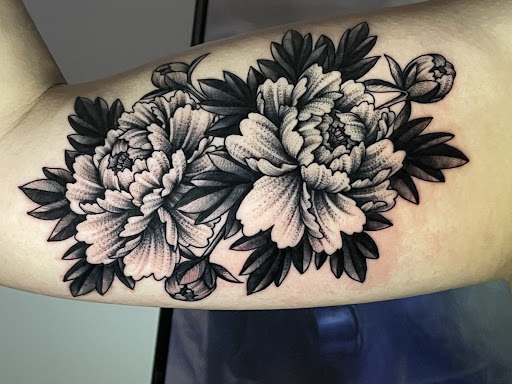 Explore dragon head tattoo ideas, creative tattoo ideas in Greensboro, available at Tried and True Tattoo Company