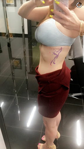 Explore invincible tattoo ideas, creative tattoo ideas in Addison, available at Cat Tattoo