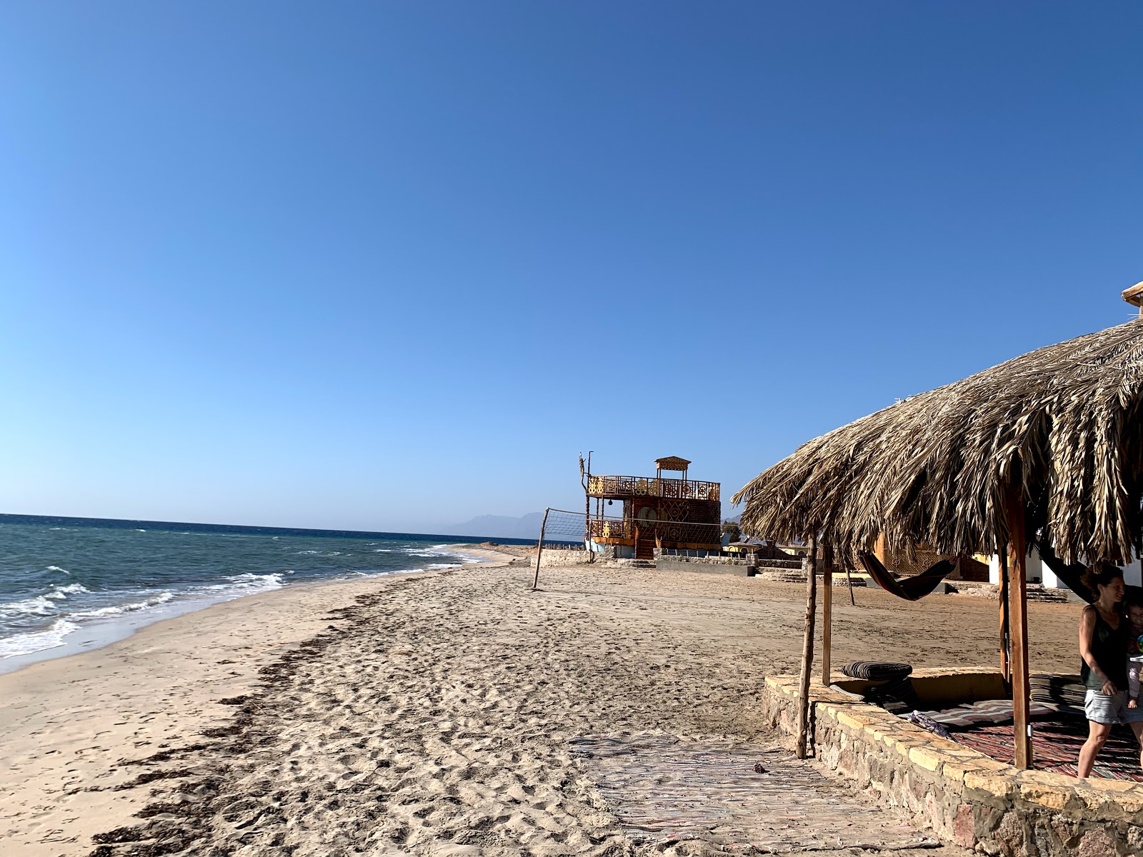 Fotografie cu Dana beach cu o suprafață de nisip strălucitor