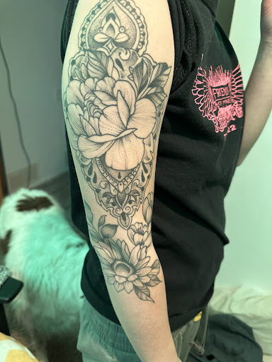 Explore haitian tattoo ideas, creative tattoo ideas in Cedar Falls, available at The Iron Quill Tattoo Parlor