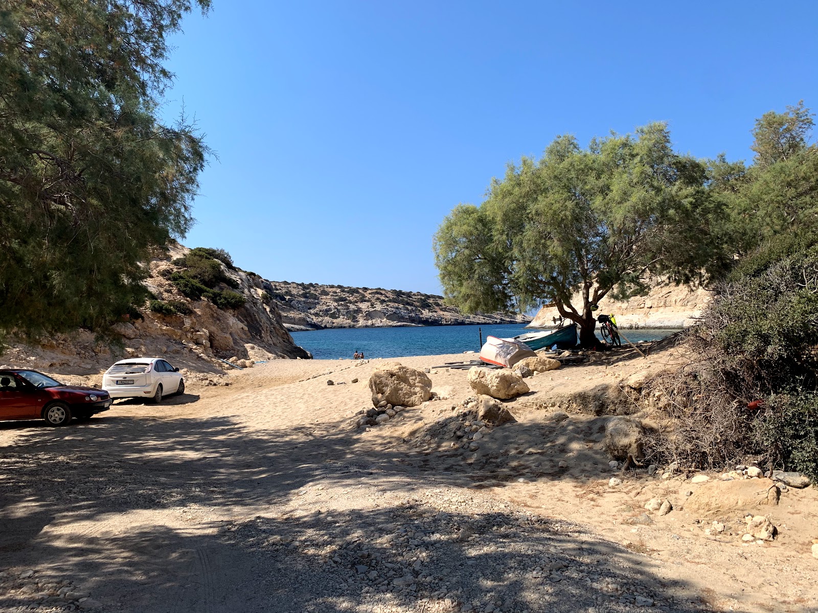 Photo of Vathi beach backed by cliffs