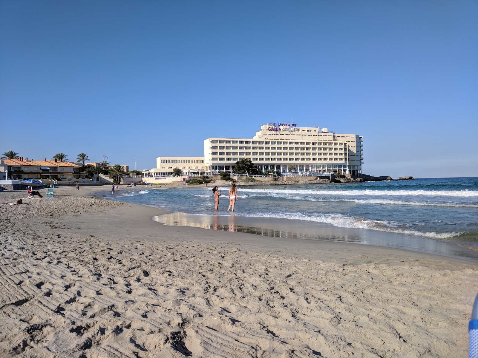 Fotografija Playa de Galua z svetel pesek površino