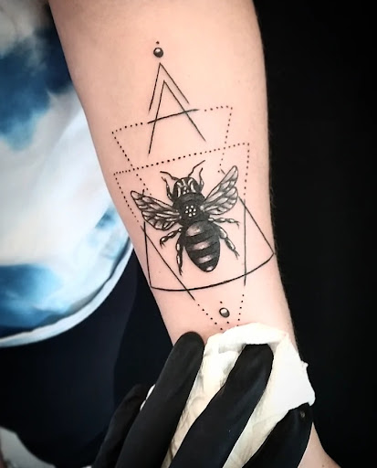 Explore cancer ribbon tattoo ideas, creative tattoo ideas in Cornelius, available at Dermal Designz Tattoo and Piercing Inc.