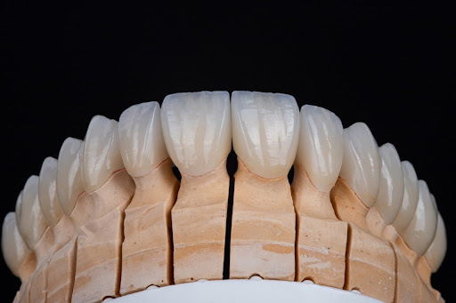 Logo da empresa - Axial - Prótese e Estética Dental